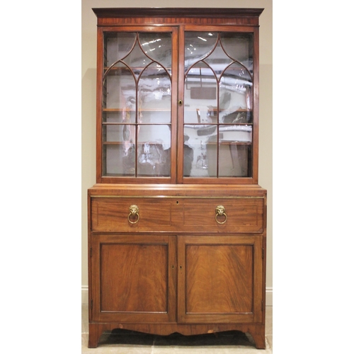 720 - A Regency mahogany secretaire bookcase, the ogee beaded astragal glazed doors opening to three adjus... 