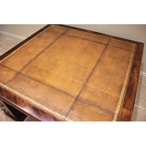 780 - A 19th century mahogany partners desk, the rectangular moulded top inset with a later gilt tooled sk... 