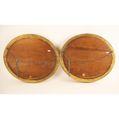 308 - Two reverse-painted landscapes on convex oval glass, late 19th or early 20th century, one depicting ... 