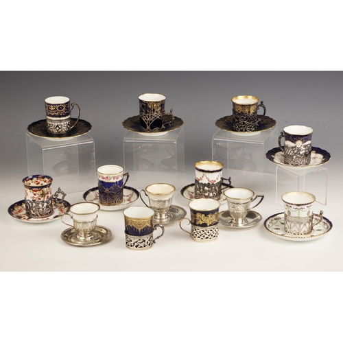 34A - A selection of silver mounted coffee cans and saucers, to include; a silver mounted Spode coffee can... 