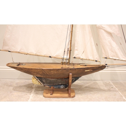 560 - A varnished wooden pond yacht of large proportions, the early 20th century hull with lead keel, late... 