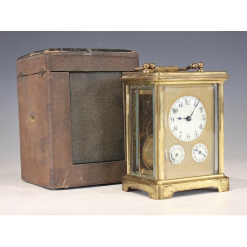 693 - A French brass cased carriage clock, late 19th century, the 4cm ceramic dial applied with Arabic num... 