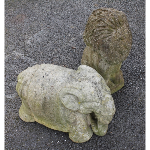 806 - Two reconstituted stone garden ornaments, one modelled as a seated lion, the other as an elephant, 4... 