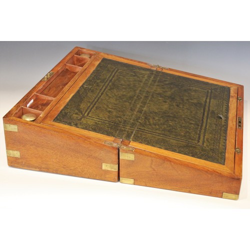 678 - A Victorian figured walnut campaign writing box, applied with brass corner brackets and vacant brass... 