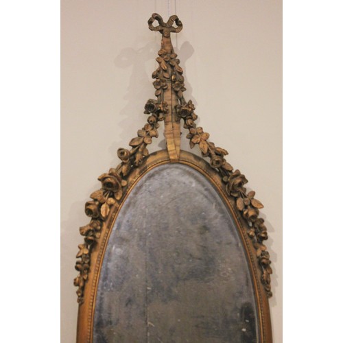 685 - A pair of French giltwood and gesso wall mirrors, late 19th/early 20th century, each with a ribbon t... 