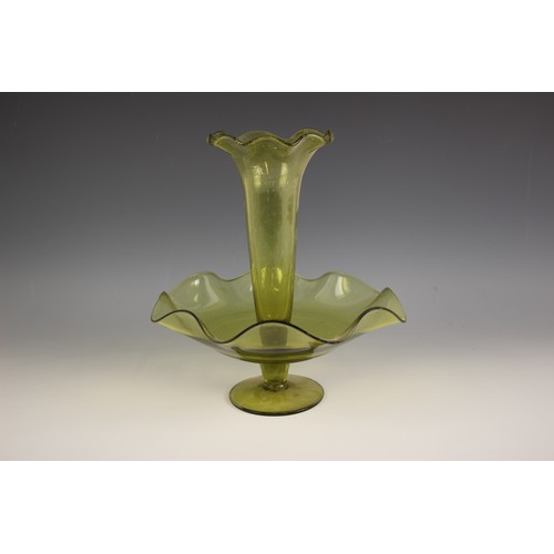 494 - A green glass epergne, the single trumpet over a shaped base, 32cm high, with three further similar ... 