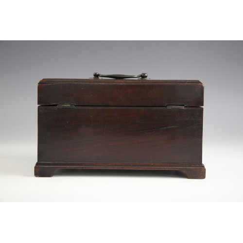 680 - A George III mahogany tea caddy, of rectangular form with lip moulded hinged cover, opening to a vac... 