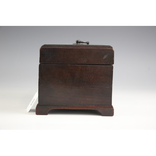 680 - A George III mahogany tea caddy, of rectangular form with lip moulded hinged cover, opening to a vac... 