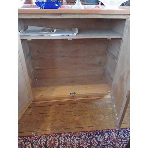 773 - A Victorian and later stripped pine scullery/kitchen cupboard, the later plank top over two pairs of... 