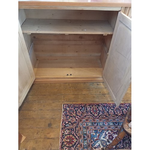 773 - A Victorian and later stripped pine scullery/kitchen cupboard, the later plank top over two pairs of... 