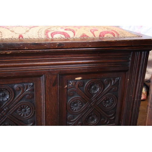 756 - An upholstered oak box settle, stamped Gillows, Lancaster, late 19th/early 20th century, the padded ... 