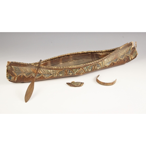 103 - A North American mic mac model canoe with paddle, late 19th century, of birch bark and porcupine qui... 