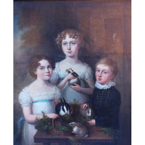 129 - Circle of Margaret Carpenter (1793-1872),  
Three Vawdrey children and their pet rabbits,  
Oil on c... 