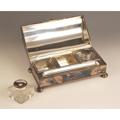 13 - An early 20th century silver plated desk tidy, the plain polished desk tidy of rectangular form with... 