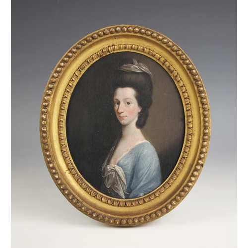 142 - Circle of John Downman (Welsh, 1750-1824),  
An oval bust length portrait of a lady wearing a blue d... 