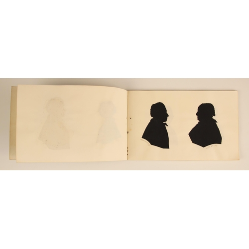 221 - * A Victorian notebook containing seven pasted-in bust length papercut portrait silhouettes, depicti... 