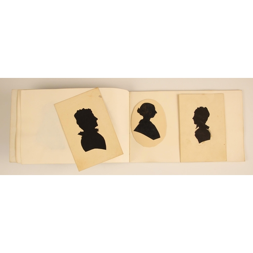 221 - * A Victorian notebook containing seven pasted-in bust length papercut portrait silhouettes, depicti... 