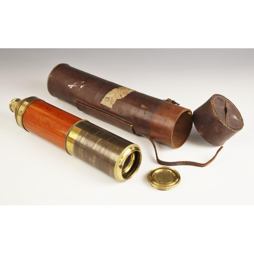 252 - A brass and mahogany day or night telescope, 19th century, the sliding four drawer telescope with en... 