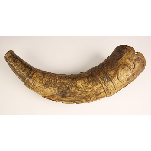 275 - A carved Swedish powder horn, 16th century, extensively carved with a soldier and canon, incised 'BE... 