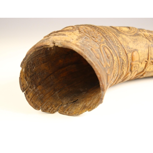 275 - A carved Swedish powder horn, 16th century, extensively carved with a soldier and canon, incised 'BE... 