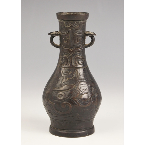 321 - A Chinese Archaic style bronze vase, in arrow type form, the swollen body leading to a tapered neck ... 