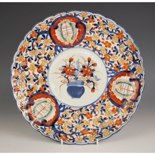 323 - A Japanese porcelain charger Meiji period (1868-1912) the lobed circular charger decorated in the im... 