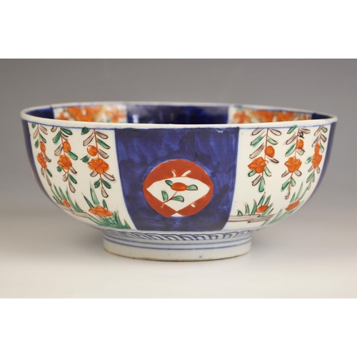 330 - A Japanese porcelain bowl, Meiji period (1868-1912) decorated in the imari palette with a panelled d... 