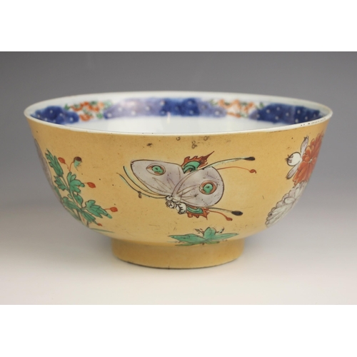 332 - A Chinese porcelain famile verte bowl, 18th century, the exterior decorated with flowering peonies a... 