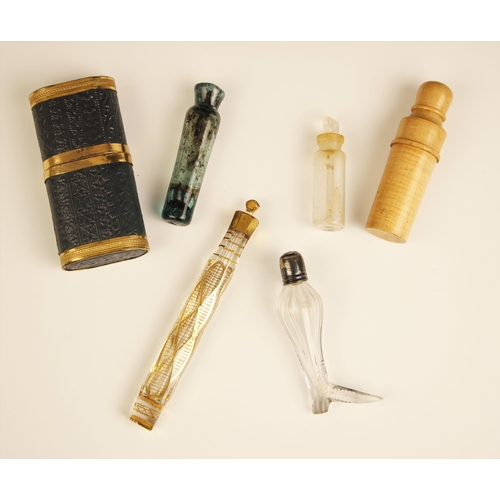 66 - An 18th century glass scent bottle, the faceted elongated scent bottle with gilt highlights througho... 