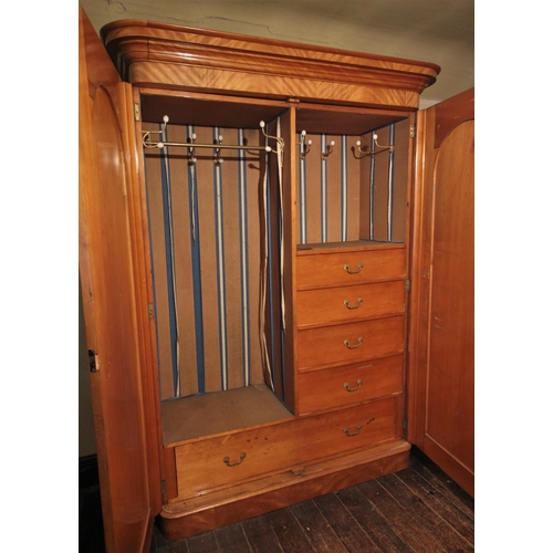 677 - * A Victorian satin birch two door wardrobe by P & J Smith, Glasgow, finished with a tiger stripe pa... 