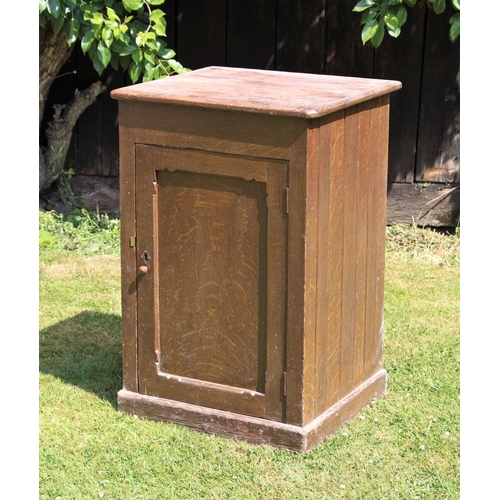 686 - * A Victorian scumbled pine cupboard, the single door opening to a single shelf upon a plinth base, ... 