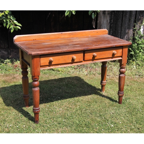 687 - * A Victorian pine dressing/side table, the rectangular top with a rear gallery and canted front cor... 