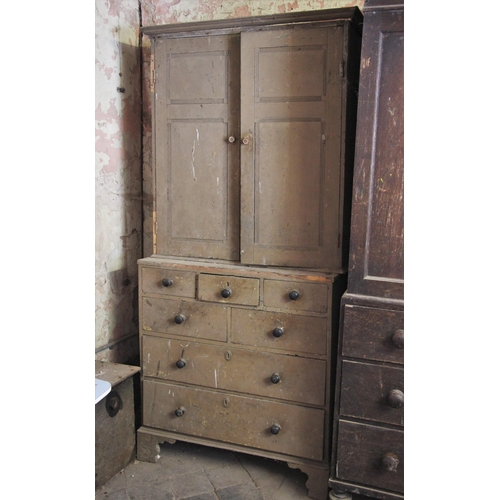 695 - * A George III painted pine housekeepers/bookcase cupboard, the pair of reeded panelled cupboard doo... 