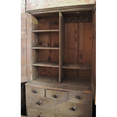 695 - * A George III painted pine housekeepers/bookcase cupboard, the pair of reeded panelled cupboard doo... 