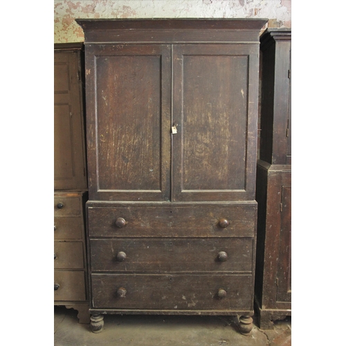 696 - * A 19th century oak linen press, the cavetto cornice over a pair of panelled doors opening to four ... 