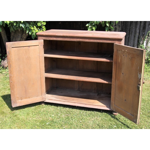 698 - * A Victorian painted pine kitchen cupboard, the moulded top over a pair of panelled doors opening t... 