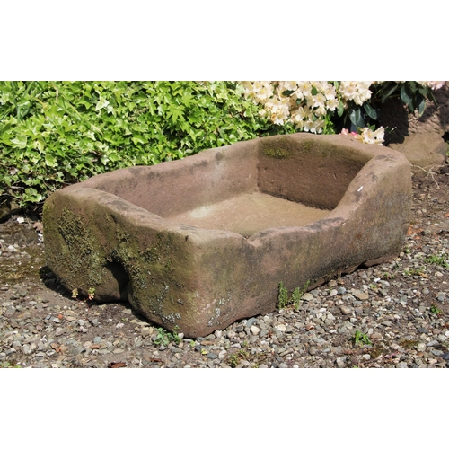 699 - * A rectangular sandstone trough 30cm H x 91cm W x 64cm D