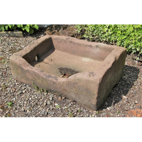 699 - * A rectangular sandstone trough 30cm H x 91cm W x 64cm D