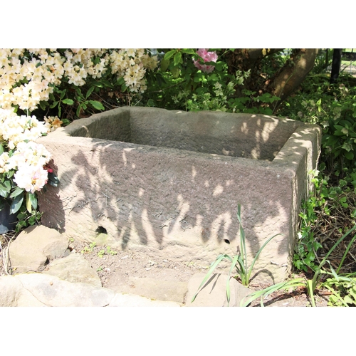 701 - * A rectangular sandstone trough 50cm H x 121cm W x 90 D