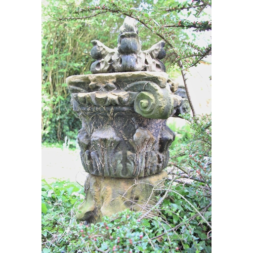 710 - * A pair of Acanthus sandstone capitals, on plinth base, 105cm H, topped with corbel (3)