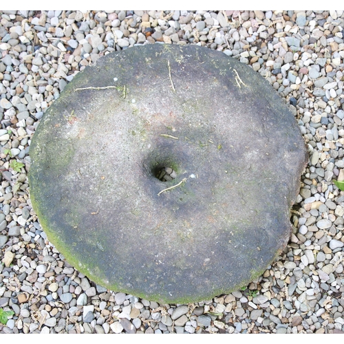 711 - * A grinding mill stone, 37cm D