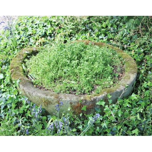 713 - * A circular sandstone trough, 30cm H x 90cm D