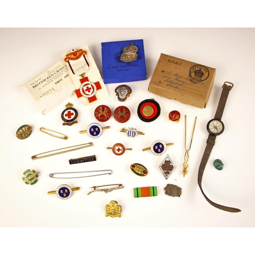 72 - A large collection of enamel badges and medals, including a ‘Proficiency in red cross first aid’ exa... 