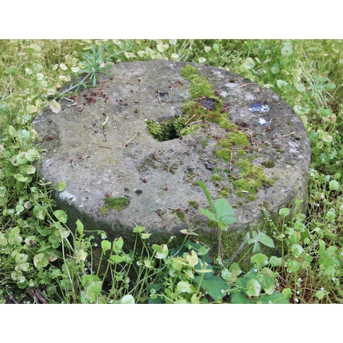 731 - * A grinding mill stone, 48cm W