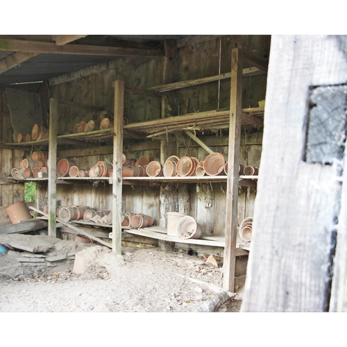 732 - * A quantity of Edwardian and later terracotta garden pots, many named and stamped (Qty)