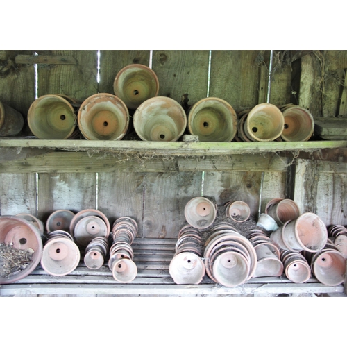 732 - * A quantity of Edwardian and later terracotta garden pots, many named and stamped (Qty)