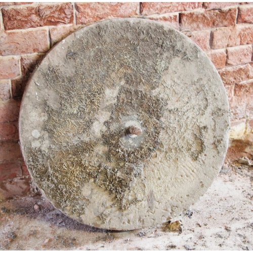 738 - * A grinding mill stone, 71cm D