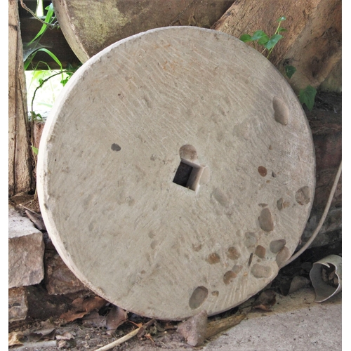 739 - * A grinding mill stone, 50cm D