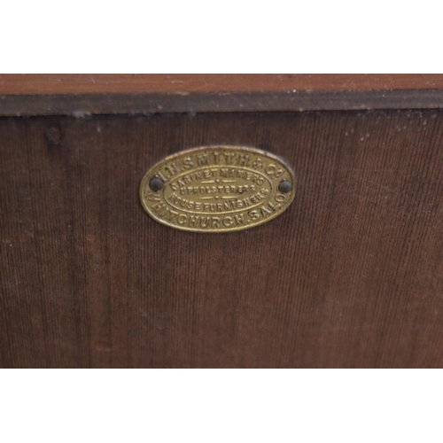 694 - An Edwardian wall mounted mahogany and pitch pine cabinet, by W.H.Smith, Whitchurch, formed with two... 