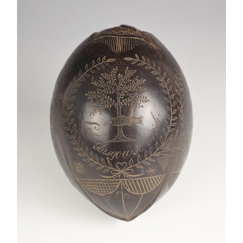 71 - An unusual carved and polished bugbear coconut flask or sailors token, early 19th century, incised w... 